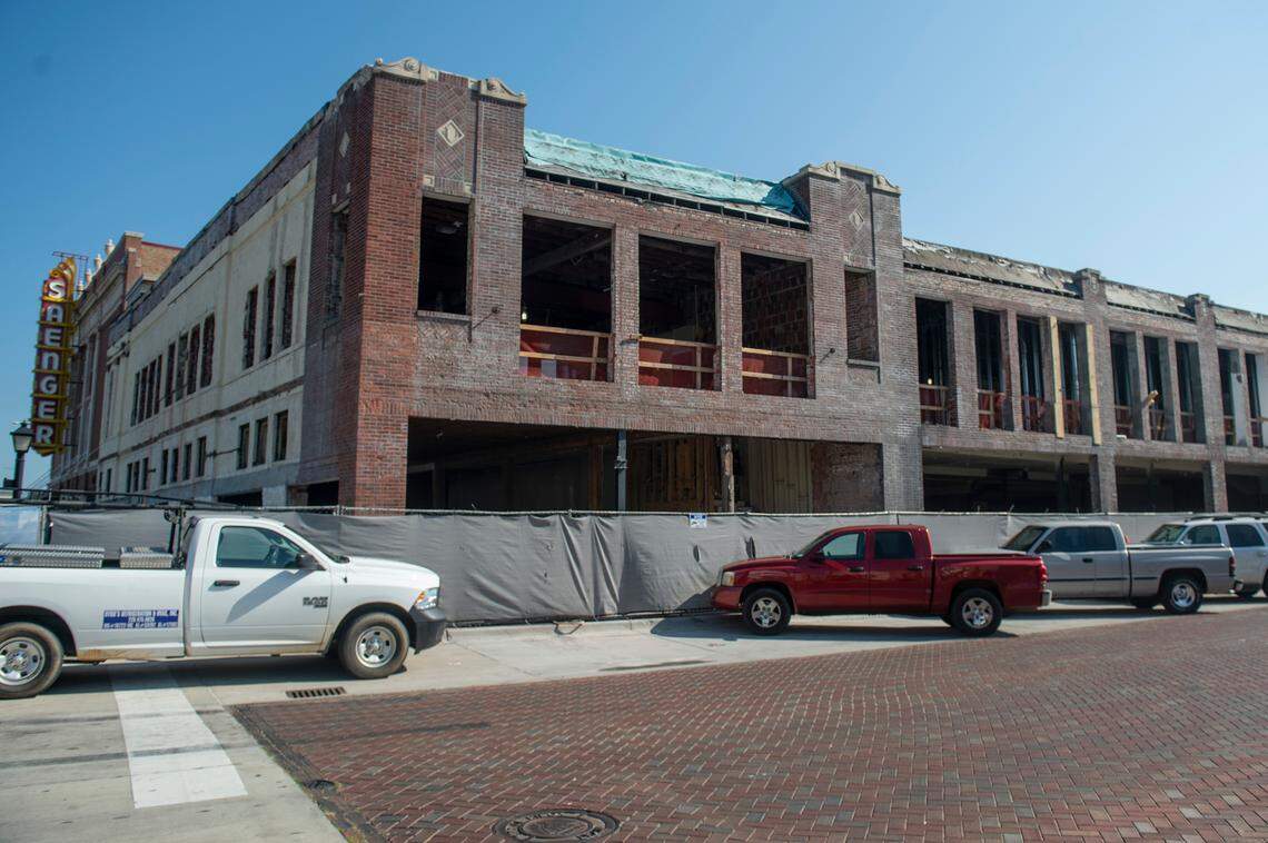 Work continues on the Barq Building, which will be restored as a mixed-use development known as The District on Howard, in downtown Biloxi on Monday, Sept. 19, 2022. The old storefronts have been taken out, the second floor windows removed and the original facade uncovered.