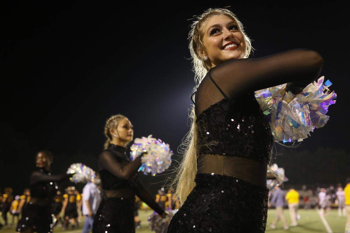 The D’Iberville Darlings dance team does a routine on the sidelines of the Warriors’ game against Biloxi Friday, Sept. 25, 2020.