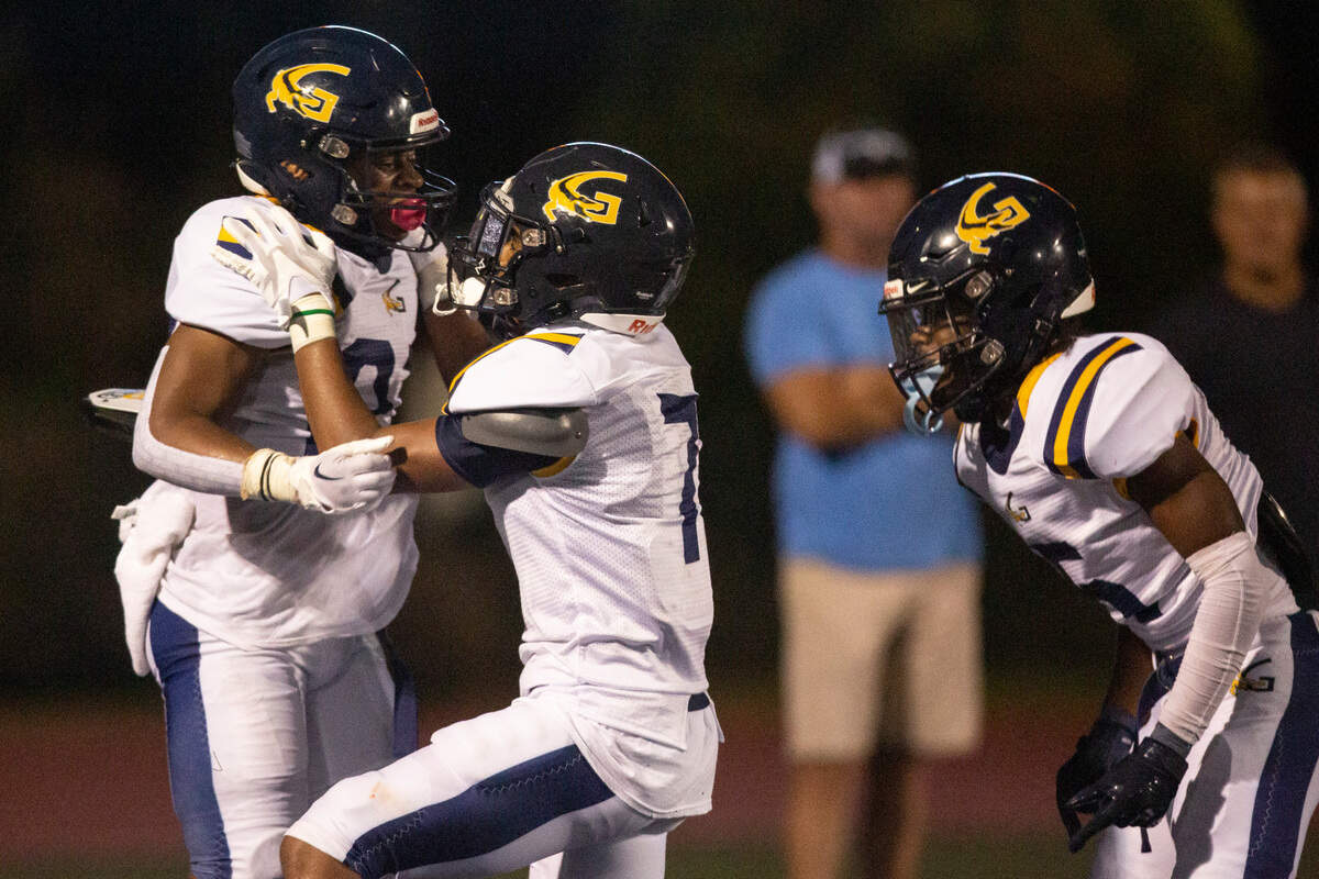 Gautier’s Marcus Cunningham and Chris McCann celebrate in the end zone after a touchdown during a Jamboree game against Ocean Springs at Greyhound Stadium on Friday, Aug. 19, 2022.