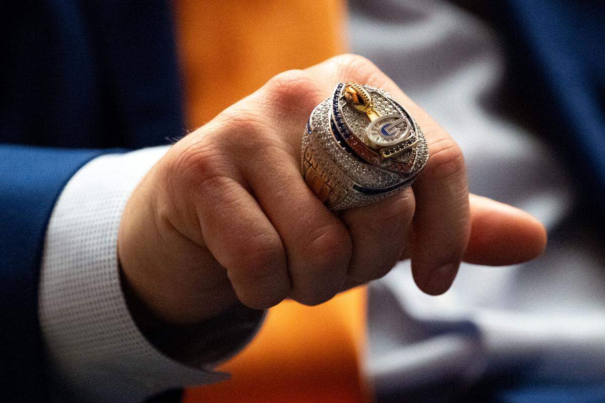 Gulfport coaches try on their championship rings Tuesday.