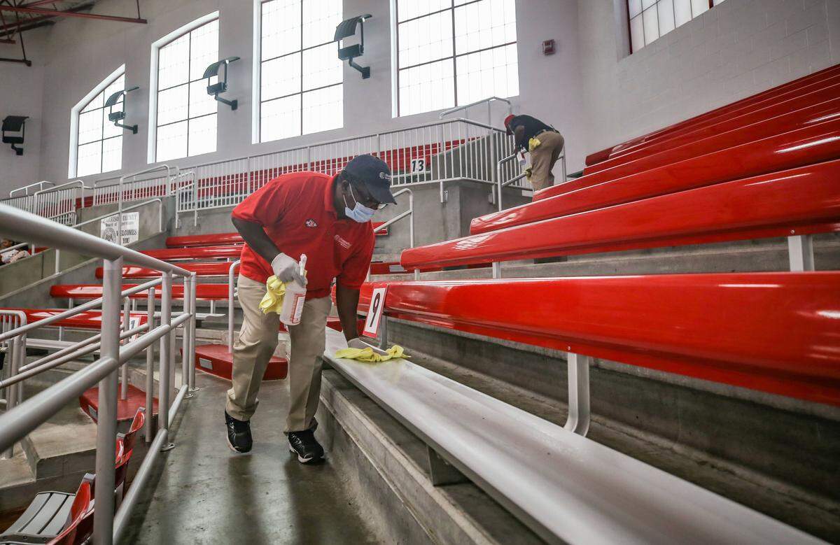 Between each graduation session, crews sanitized the bleachers of Biloxi’s gymnasium to prepare for the next graduation. Staff cleaned the bleachers, handrails and each student’s chair on the court.