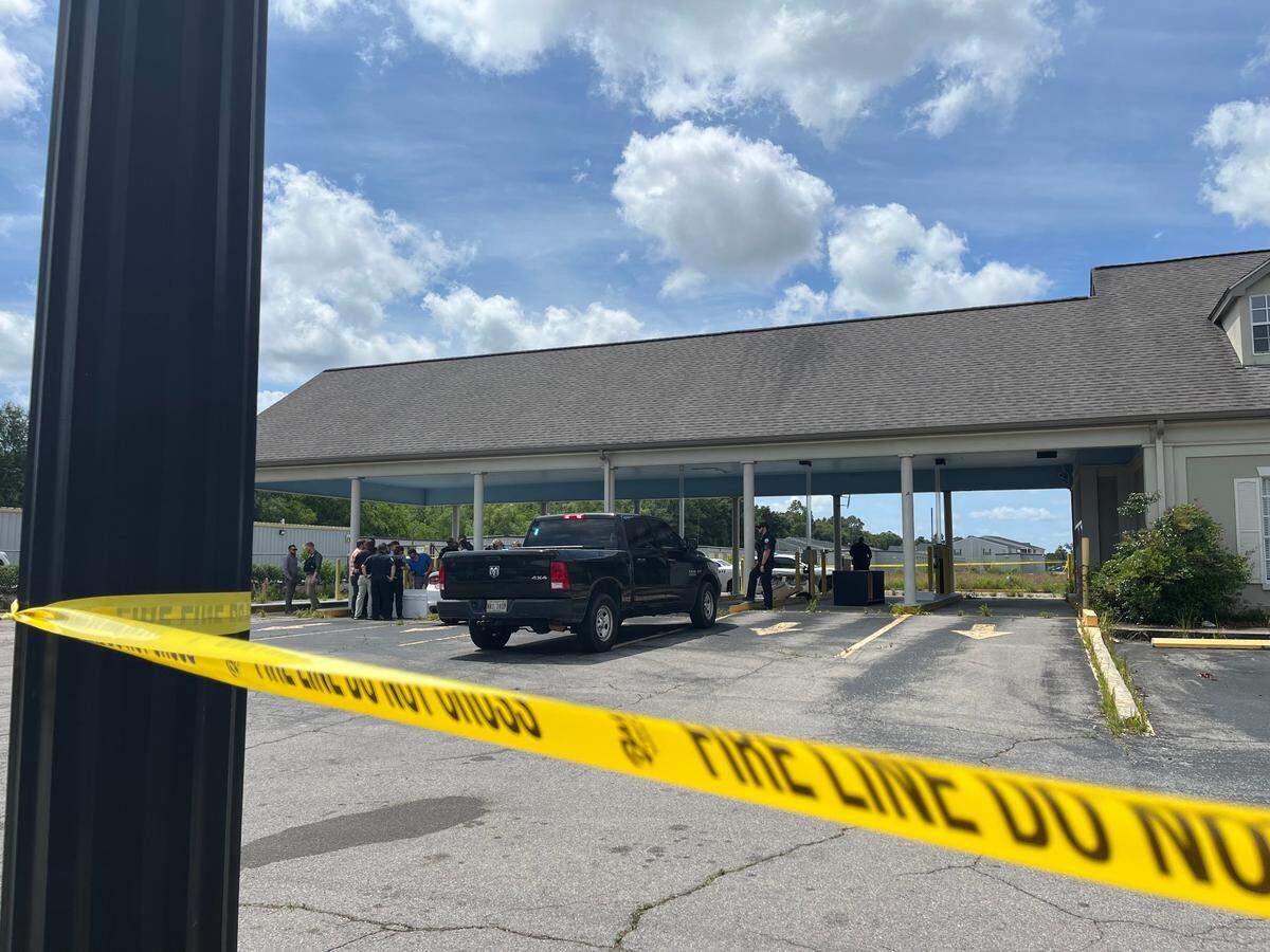 Yellow tape surrounds the scene of an officer-involved shooting in Gulfport on Wednesday morning.