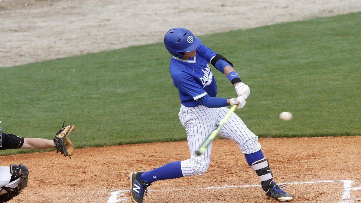 TIM ISBELL/SUN HERALD 
 Ocean Springs third baseman Drew Windham knocked in four runs to lead the Greyhounds to a victory over Oak Grove, Saturday, March 26, 2016.