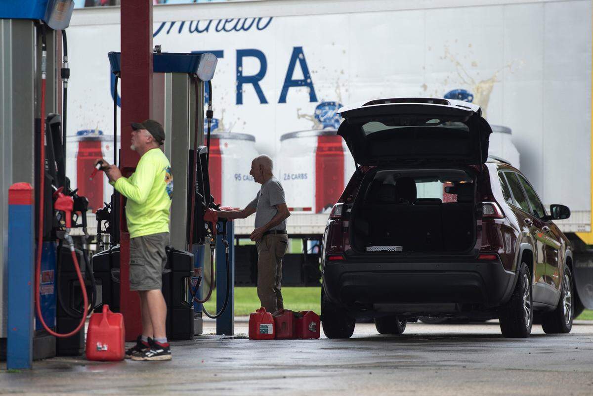 Motorists fill gas tanks at Keith’s Superstore in Waveland on Tuesday, ahead of Hurricane Francine.