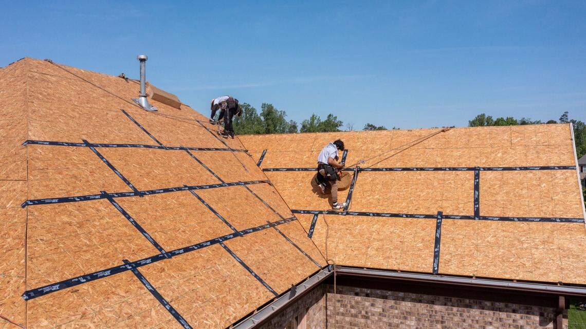 Roofers install modified bitumen tape to seal the roof’s deck on the FORTIFIED home of an IBHS member in Waxhaw, NC in May of 2023.