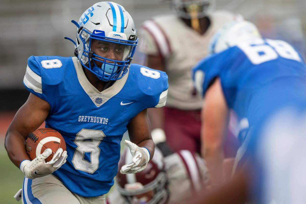 Ocean Springs’ Will Smith runs the ball during a Spring Game against Picayune at Greyhound Stadium in Ocean Springs on Friday, May 13, 2022.