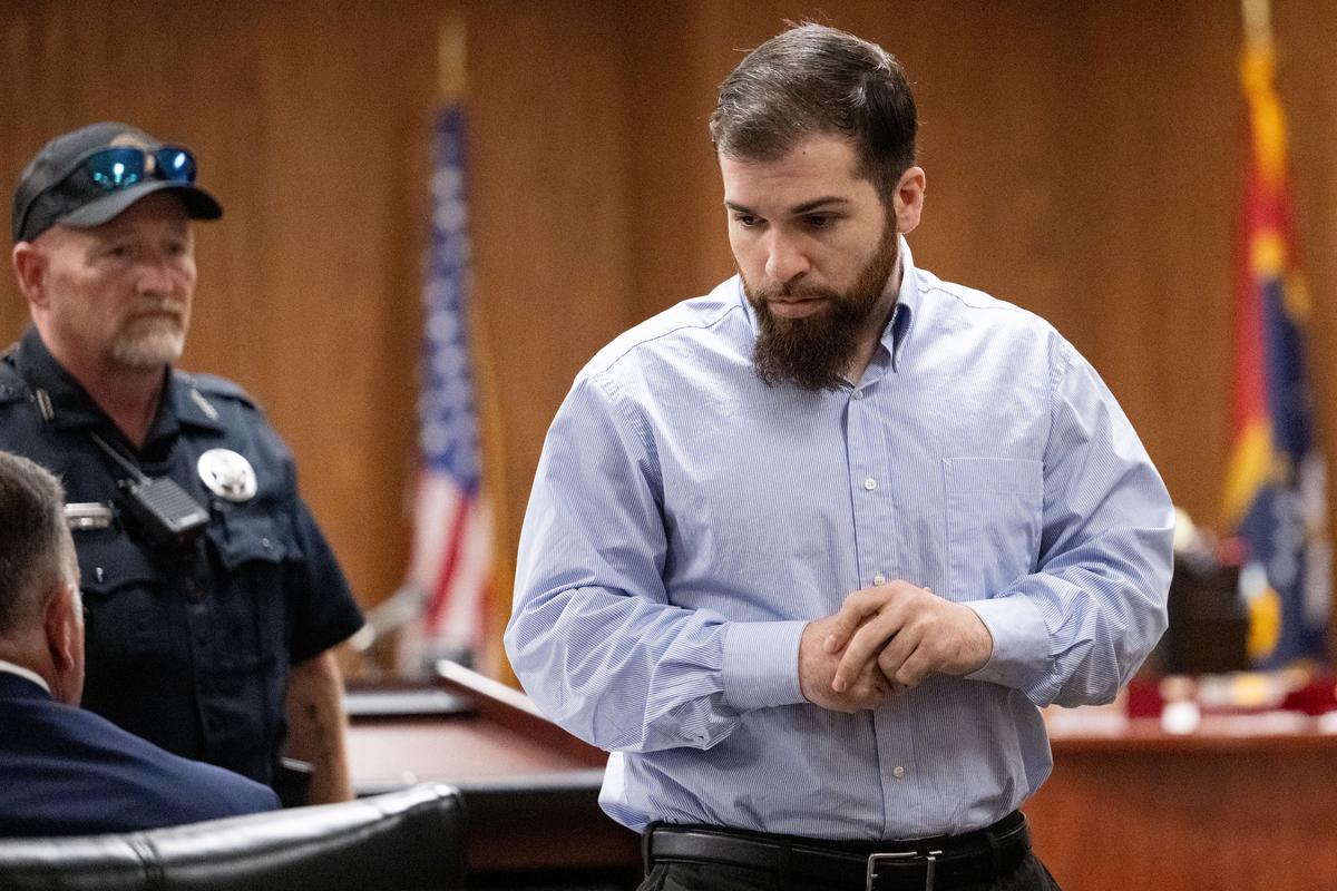 Logan D’Elena walks into the courtroom Thursday.