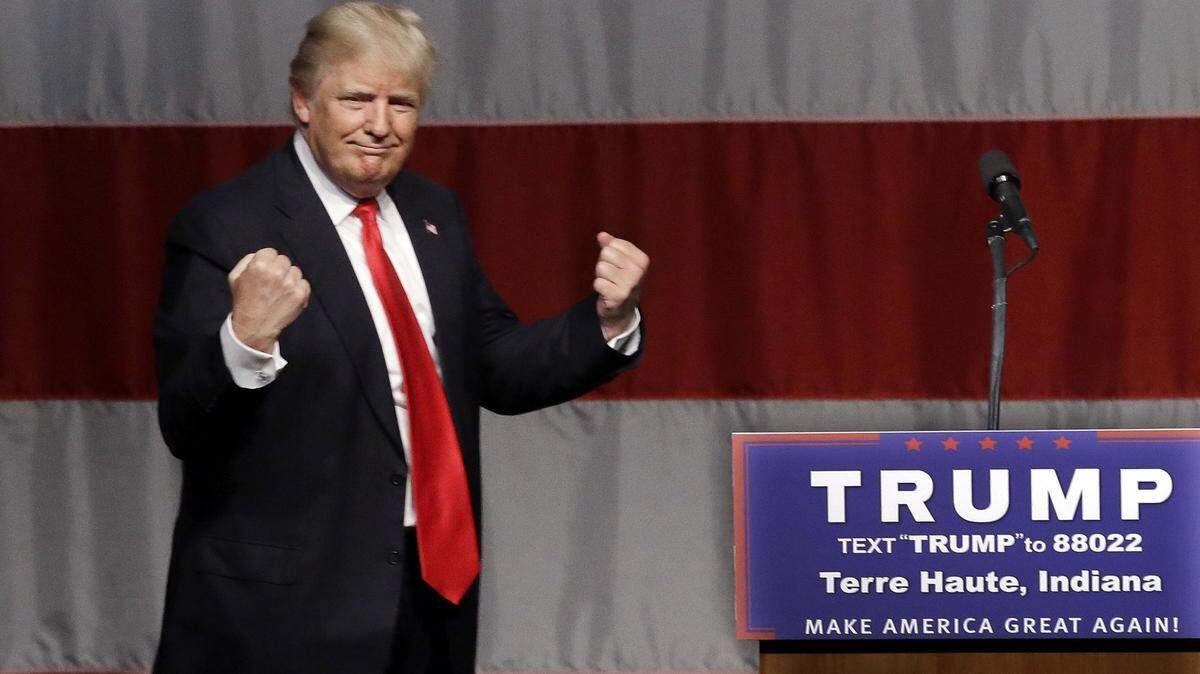 FILE - In this Sunday, May 1, 2016 file photo, Republican presidential candidate Donald Trump reacts to a song during a campaign rally at the Indiana Theater in Terre Haute, Ind. (AP Photo/Seth Perlman)