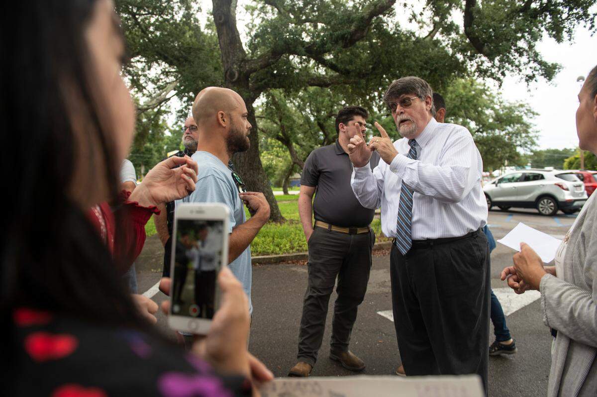 Rev. Blair Bradley, pastor for the Covenant of Peace Church in Harrison County, argues with protestors who are against removing library books outside the West Biloxi library in Biloxi where a library board meeting was being held on Monday, July 25, 2022. Bradley was one of two people who spoke to Biloxi City Council and asked them to consider removing children’s books that are inclusive of LGBTQ+ people.