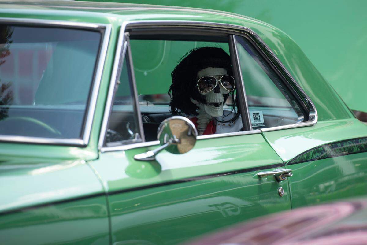 A plastic skeleton sits in a car during the Biloxi Block Party, a Cruisin’ The Coast event in Biloxi on Wednesday, Oct. 9, 2024.
