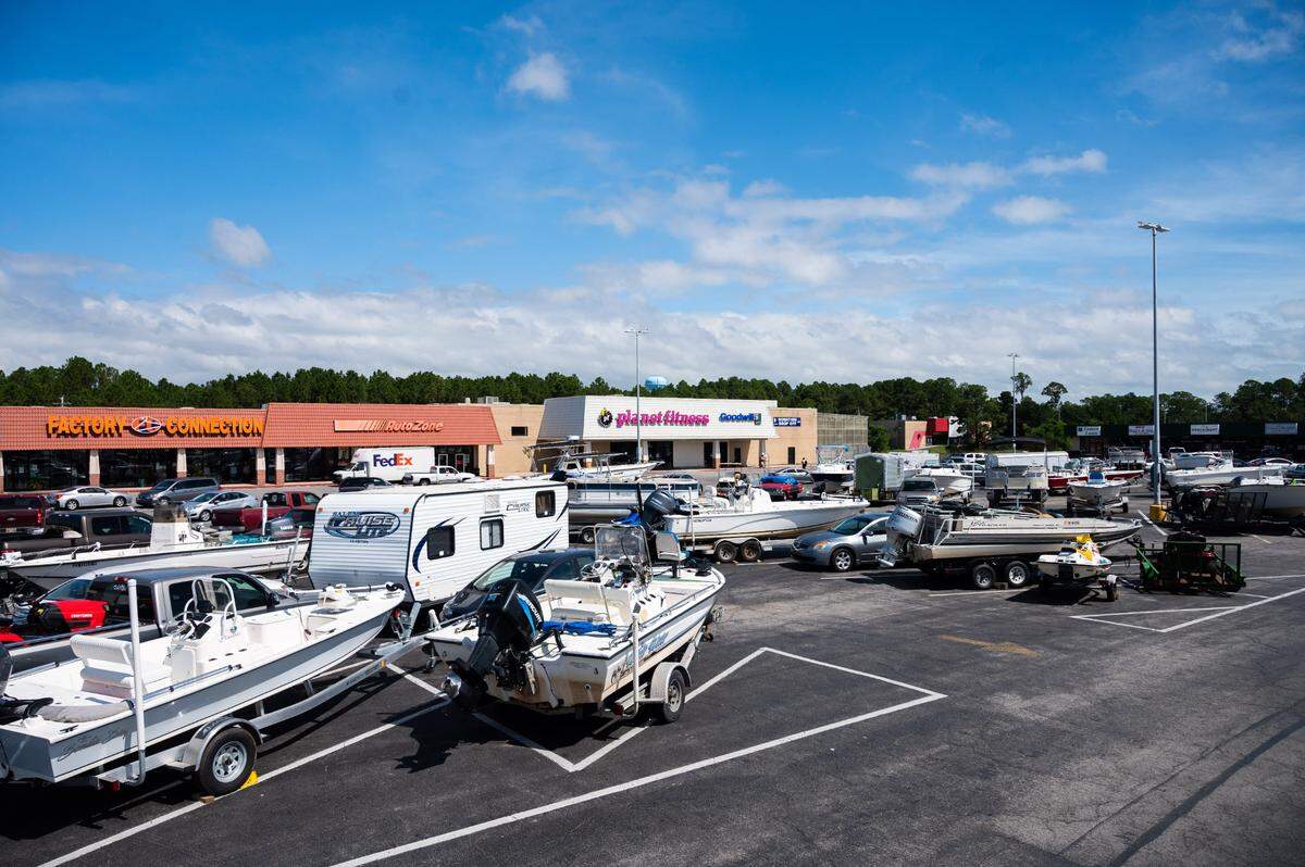Mississippi Coast residents have moved their boats from evacuated piers and harbors into a strip mall parking lot in Bay St. Louis on Monday, Sept. 14, 2020.