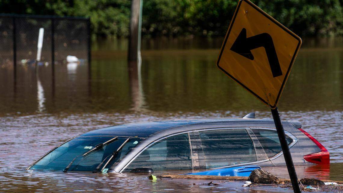 A car flooded on a local street as a result of the remnants of Hurricane Ida is seen in Somerville, N.J. Thursday, Sept. 2, 2021. (AP Photo/Eduardo Munoz Alvarez)