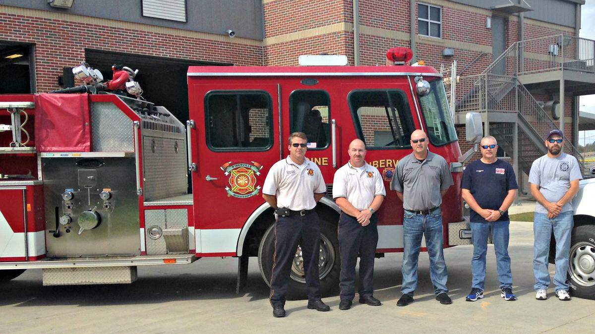 PHOTO COURTESY OF D'IBERVILLE FIRE DEPARTMENT 
 D'Iberville on Tuesday donated a 1992 fire truck to Pearl River County. From left are D'Iberville Fire Department Deputy Chief Danny Miller and Fire Chief Gerald Smith, Pearl River County EMA/Fire Coordinator Danny Manley and Chief Scott Sullivan and Michael Harris with Henleyfield Volunteer Fire Department in Pearl River County.