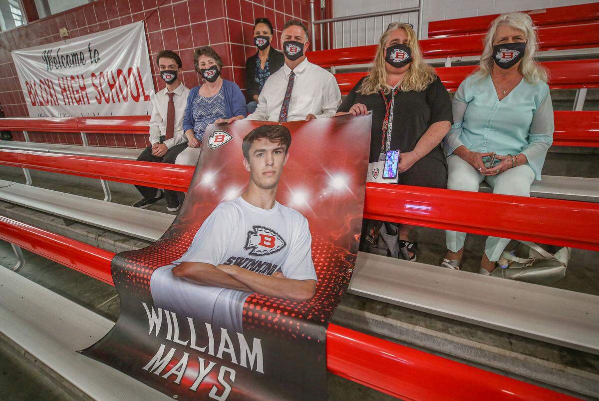 Biloxi senior William Mays’ family is seated ahead of the first round of graduations May 19, 2020 at Biloxi High School. His family wore masks with the Biloxi logo as families were seated in numbered sections to encourage social distancing.