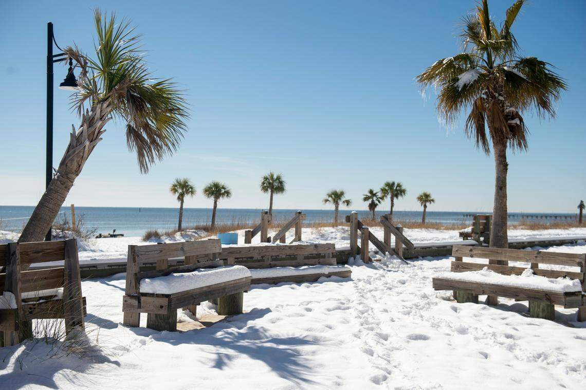 A rare scene in South Mississippi: Snowfall accumulating at the beach.