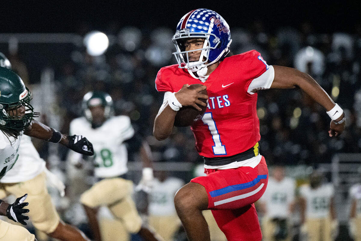 Pass Christian quarterback Paris Trivillion (1) picks up yards Friday in a first-round playoff victory over South Pike.
