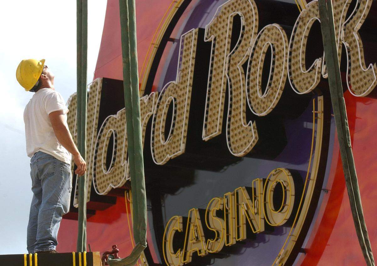 An employee of Kojis & Sons Signs works to install the Hard Rock Casino guitar sign in Biloxi in July 2005. It set a world’s record for the tallest guitar at the time and remains the most iconic casino sign and symbol in South Mississippi.