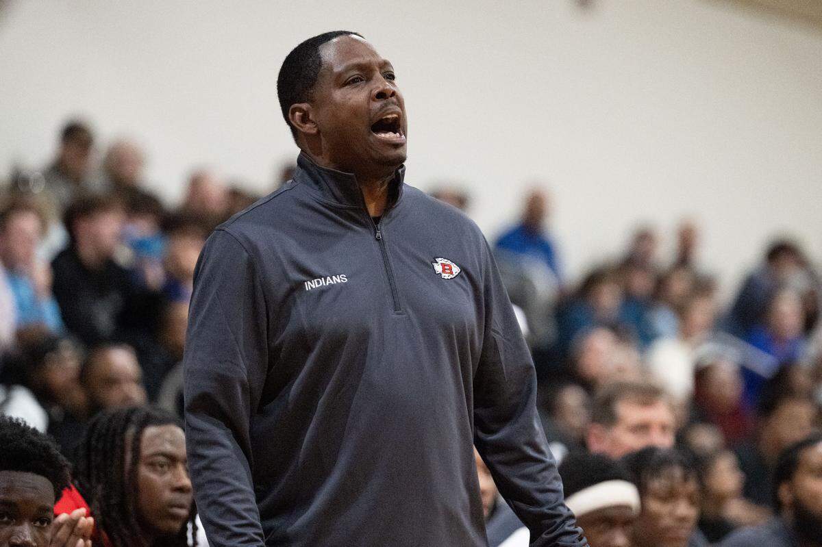 Biloxi head coach Seber Windham shouts to his players from the sideline during a basketball tournament at D’Iberville High School on Wednesday, Feb. 11, 2026.