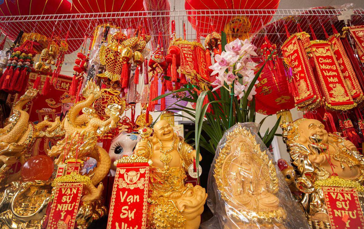 At Lee’s Market, the Vietnamese grocery store on Division Street, the Lunar New Year was still celebrated inside with decorative lanterns, statues and wall hangings for sale Friday, February 12, 2021.