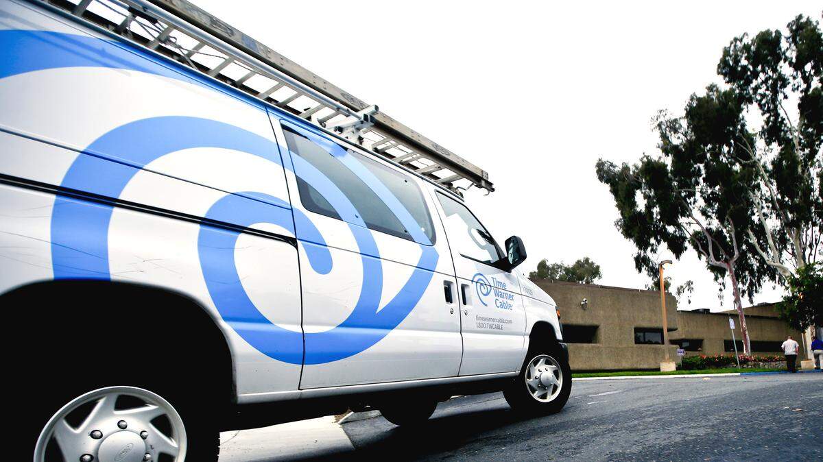 LENNY IGNELZI/ASSOCIATED PRESSA Time Warner Cable service truck returns to the company's offices in Carlsbad, Calif.
