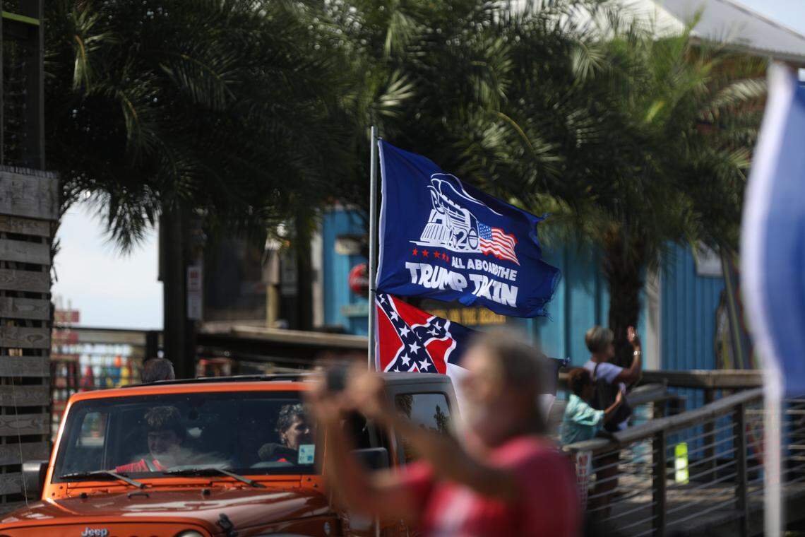 Hundreds of people participated in a Jeep parade supporting President Donald Trump in Bay St. Louis, Mississippi, on Saturday, Sept. 12, 2020. Some also flew the retired Mississippi state flag with the Confederate emblem.