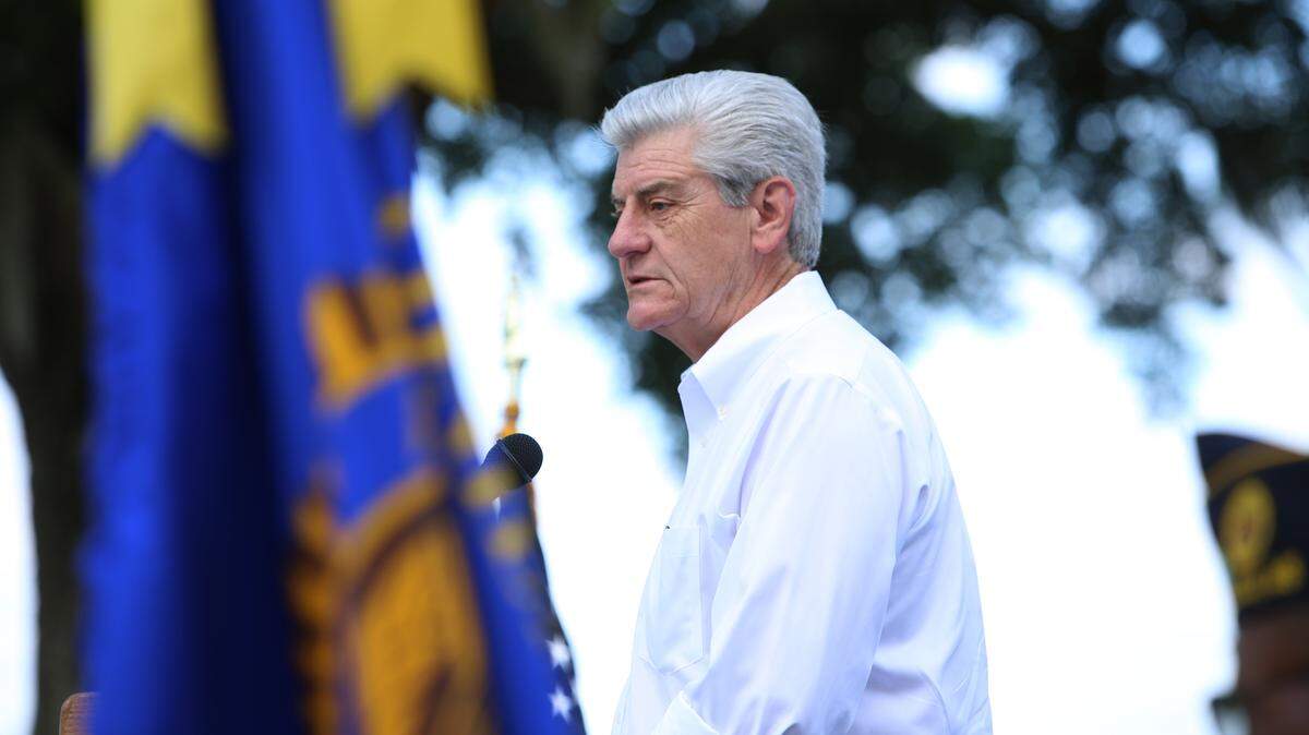 Gov. Phil Bryant speaks at a Memorial Day ceremony at Biloxi National Cemetery on May 27, 2019.