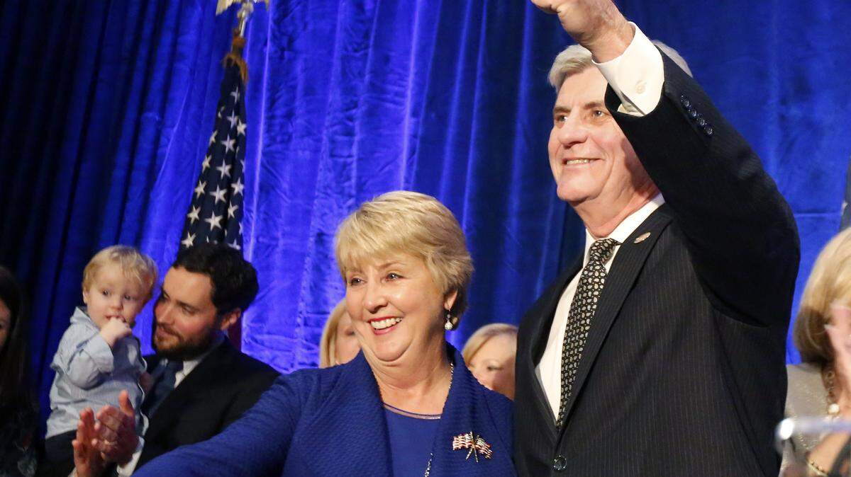 ROGELIO V. SOLIS/ASSOCIATED PRESSRepublican Gov. Phil Bryant and wife, Deborah, celebrate his re-election to his second term Nov. 3 in Jackson. A spokesman said Gov. Bryant cut taxes 49 times in his first term.