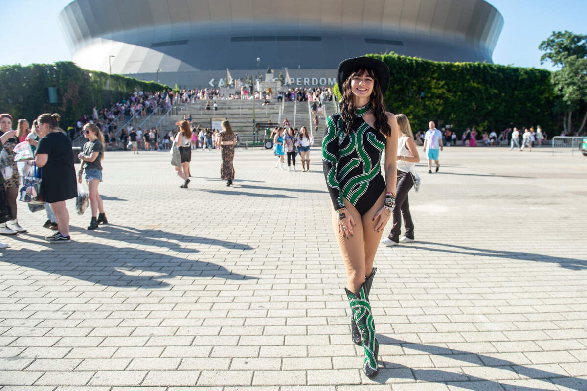 A fan shows off her outfit outside the Cesars Superdome in New Orleans on Friday, Oct. 25, 2024, before Taylor Swift’s Eras Tour performance that night.