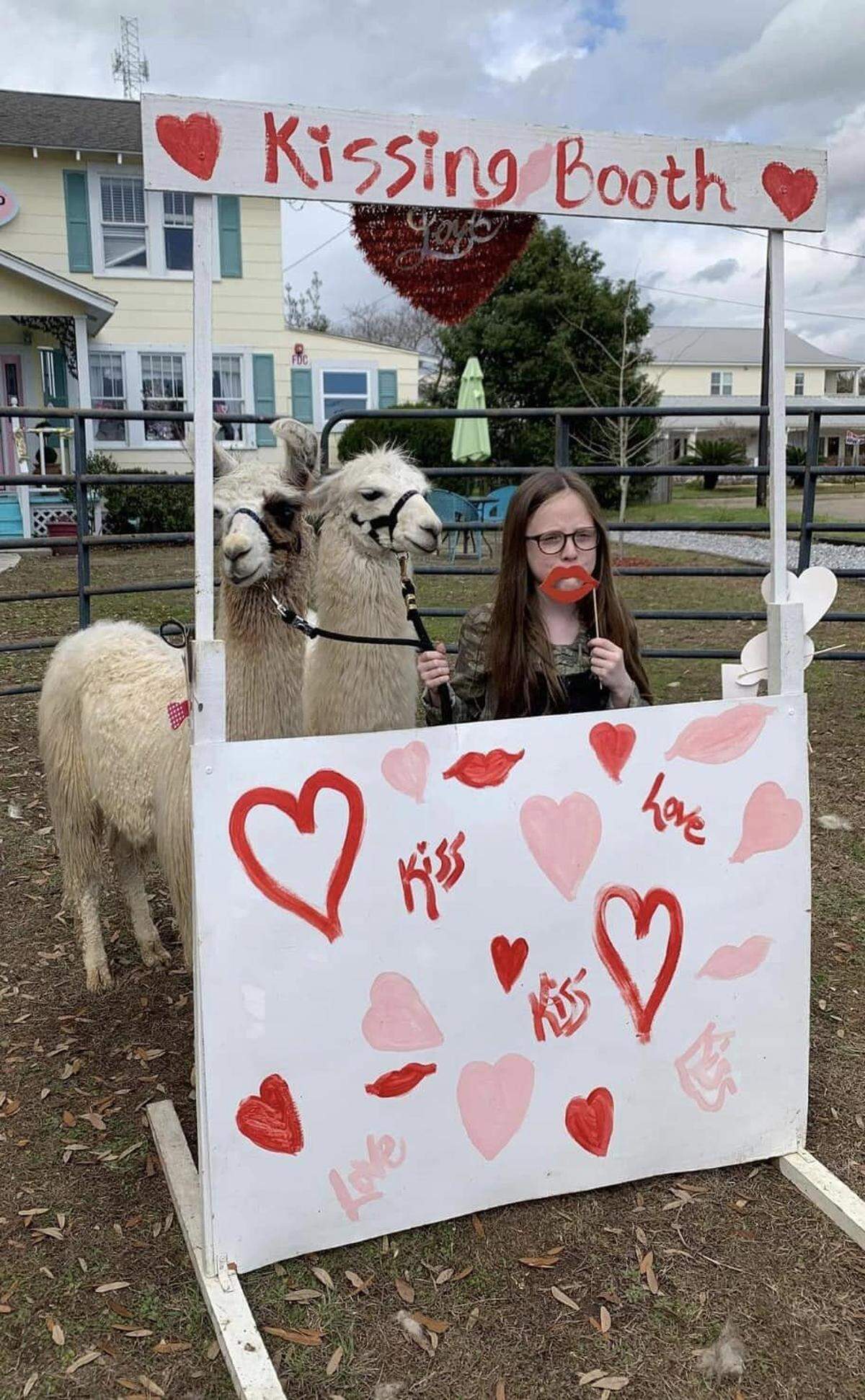 Of course, Pass Christian’s Christmas festivities include a llama kissing booth.