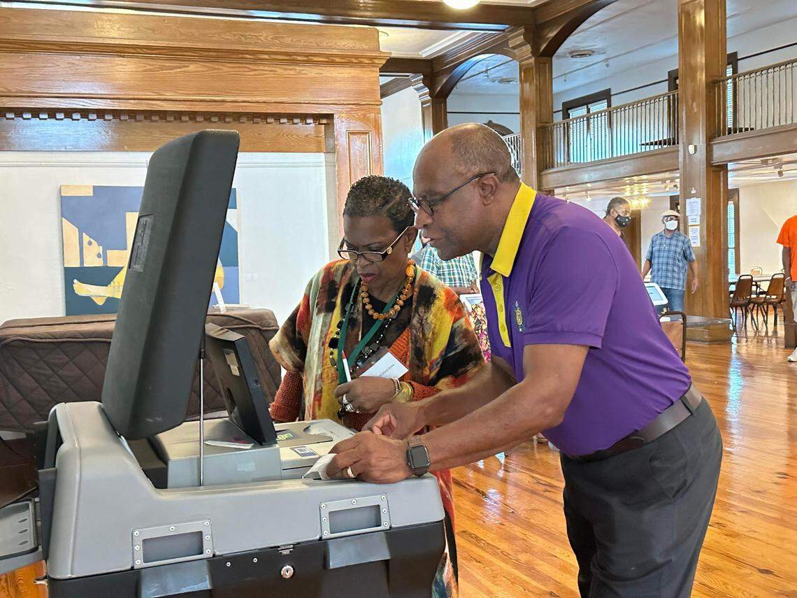 Democratic congressional candidate Johnny DuPree casts his ballot with the help of Hattiesburg Cultural Center poll manager Jocelyn Page, Tuesday, Nov. 8, 2022. DuPree, 68, served four terms as mayor of Hattiesburg.