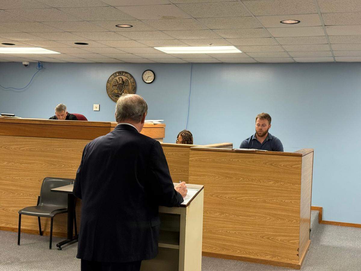 Harrison County Prosecuting Attorney Herman Cox questions Gulfport Police Detective Liam Cogley during a preliminary hearing in the attempted murder case of Floyd Charles Guy. Judge Nick Patano presided over the proceeding.