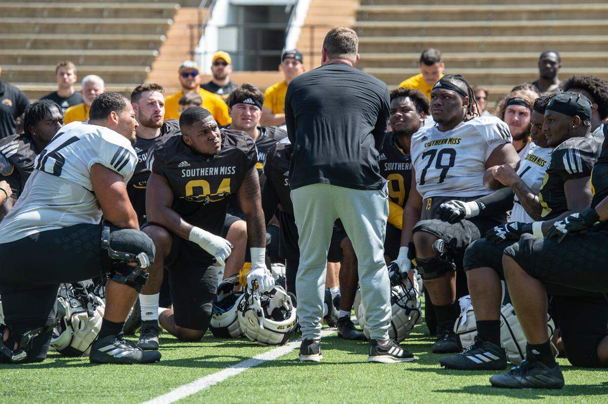 Coach Will Hall talks with his players after the Spring Game at M.M. Roberts Stadium in Hattiesburg on Friday, April 1, 2022.