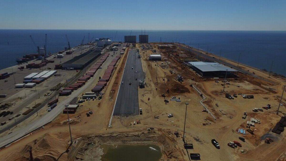 COURTESY WARREN PAVING 
 This aerial of West Pier construction was shot in mid-March. W.C. Fore Trucking Inc. has filed a lawsuit over losing the $44 million contract for work on the pier's east side. Necaise Bros. Construction Co., which secured the bid, also has the contract for ongoing construction work on the pier's west side.