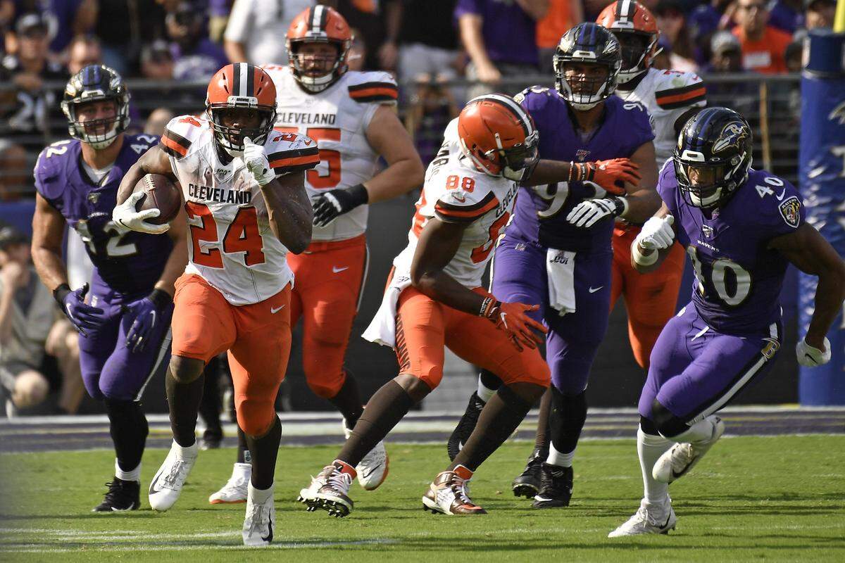 Cleveland Browns running back Nick Chubb (24) takes off for a long touchdown run against the Baltimore Ravens during the second half of an NFL football game Sunday, Sept. 29, 2019, in Baltimore. (AP Photo/Brien Aho)