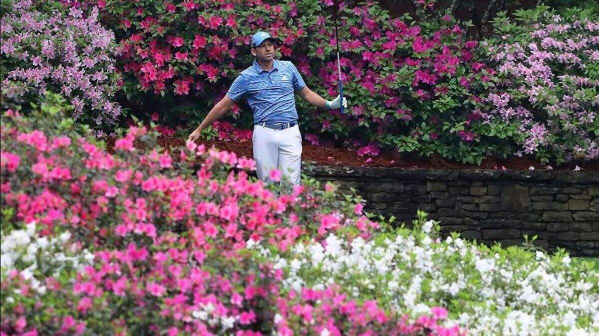 Defending Masters champion Sergio Garcia watches his drive from the tee box on the 13th hole during his practice round for the Masters at Augusta National Golf Club on Wednesday, April 4, 2018, in Augusta, Ga. Next year, women will be teeing off from the azalea-banked 13th as part of the Augusta National Women's Amateur