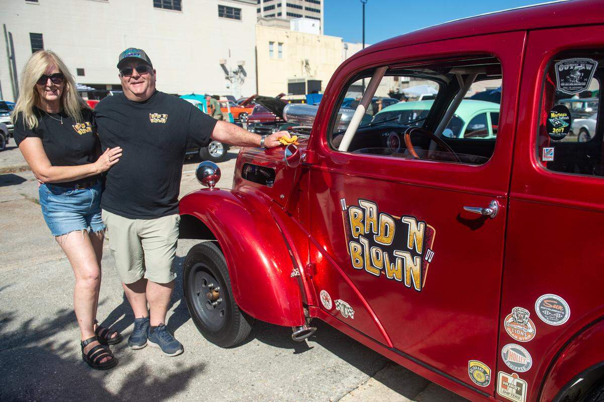 Martin Bishop and his wife Sandra Molton in front of Bishop’s 1952 Ford Anglia during View the Cruise at Cruisin’ The Coast in Gulfport on Sunday, Oct. 6, 2024.