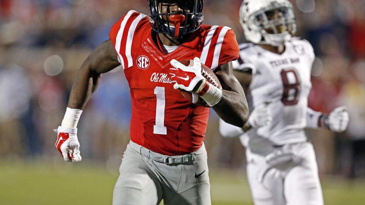 ROGELIO SOLIS/ASSOCIATED PRESS 
 Ole Miss wide receiver Laquon Treadwell (1) sprints away from Texas A&M defensive back Nick Harvey (8) for a 58 yard touchdown reception in Oxford Saturday.