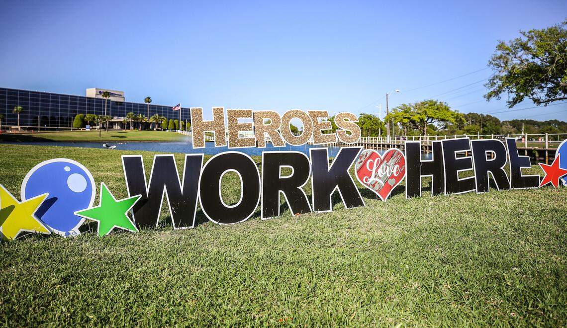 A “Heroes Work Here” sign stands outside of Singing River Hospital in Pascagoula.