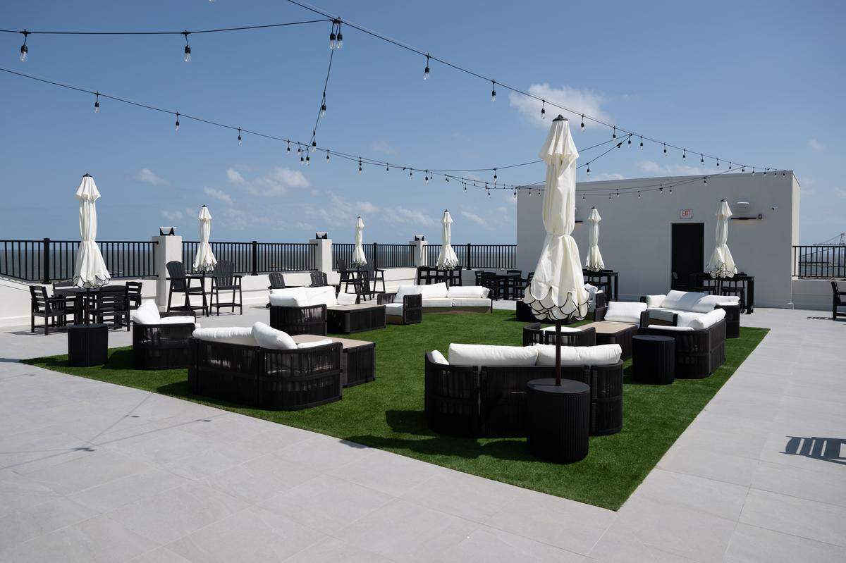A rooftop patio at the Markham Hotel in Gulfport is a scenic place for a drink during the day or under the stars at night.