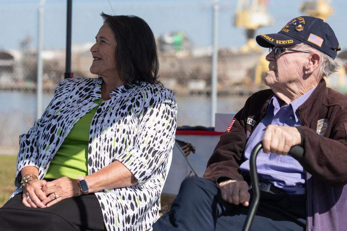 WWII veteran Alfred Lewis and his daughter Rhonda Parker listen to a speech about during a ceremony commemorating Iwo Jima at Singing River Island in Pascagoula on Saturday, March 22, 2025.