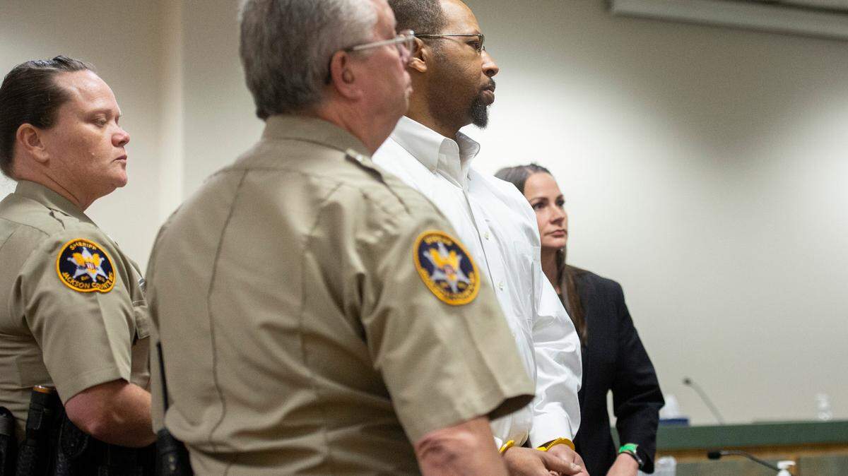 Dion Neal is led away in handcuffs after receiving a guilty verdict in a trial for sexual battery in Jackson County Court in Pascagoula on Tuesday, Oct. 11, 2022.