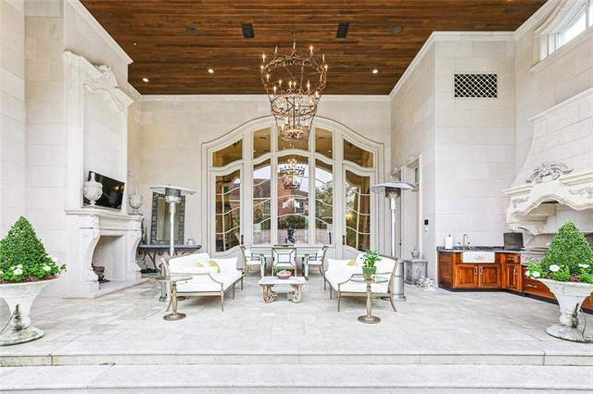 The mansion also features an in-ground cocktail pool out back.