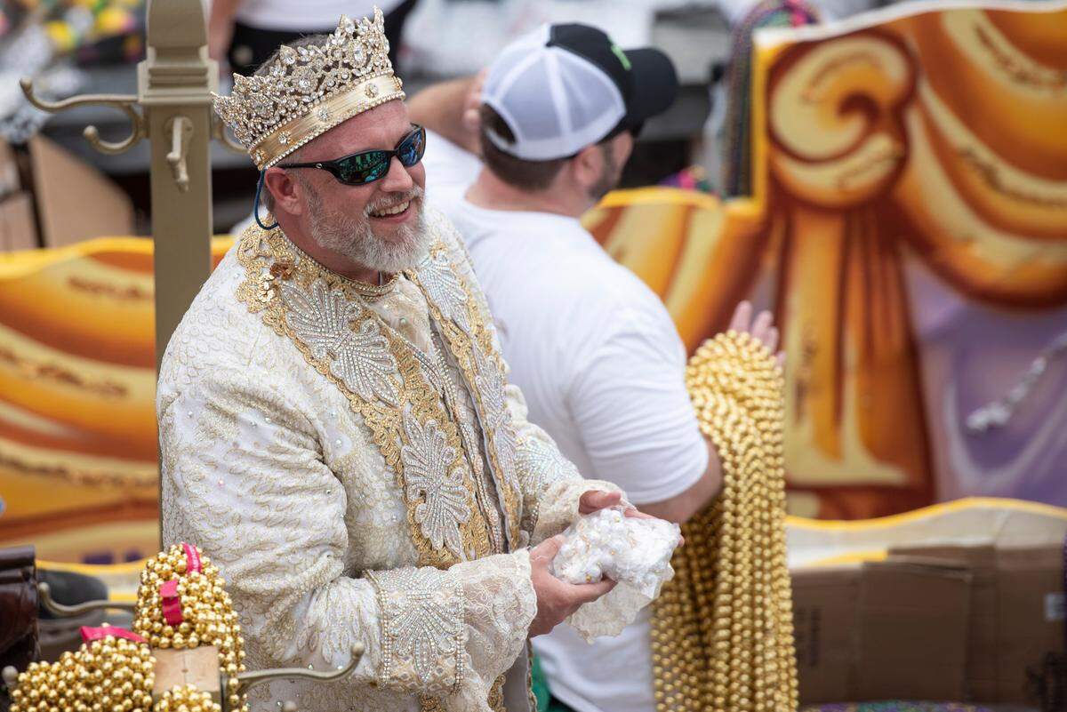 King d’Iberville Jonathan Park Allen throws beads during the Gulf Coast Carnival Association Mardi Gras parade in Biloxi on Tuesday, March 4, 2025.