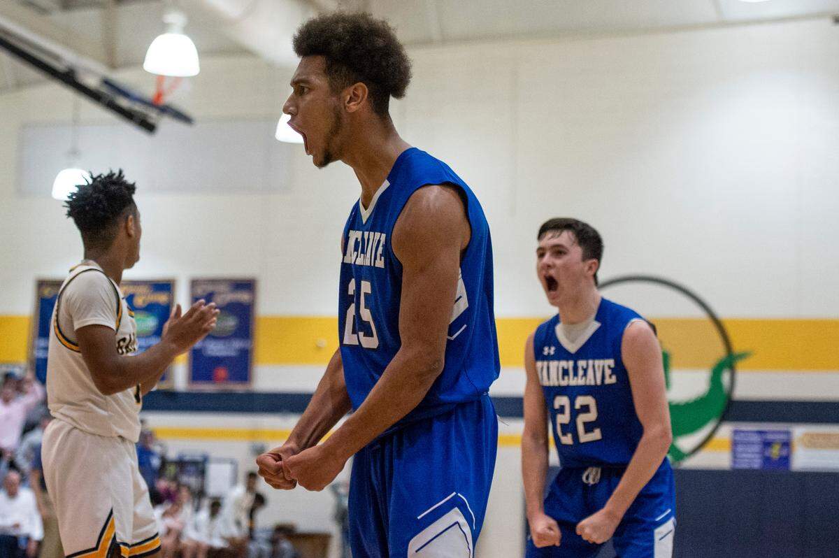 Vancleave forward Oscar Hampton, left, and Kim Medlen cheer as they score against Gautier at Gautier High School in Gautier on Friday, Jan. 21, 2022.