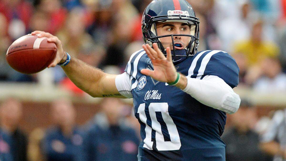 Ole Miss quarterback Chad Kelly (10) prepares to release a pass during the second quarter of an NCAA college football game against Arkansas in Oxford, Miss., Saturday, Nov. 7, 2015. (AP Photo/Thomas Graning)