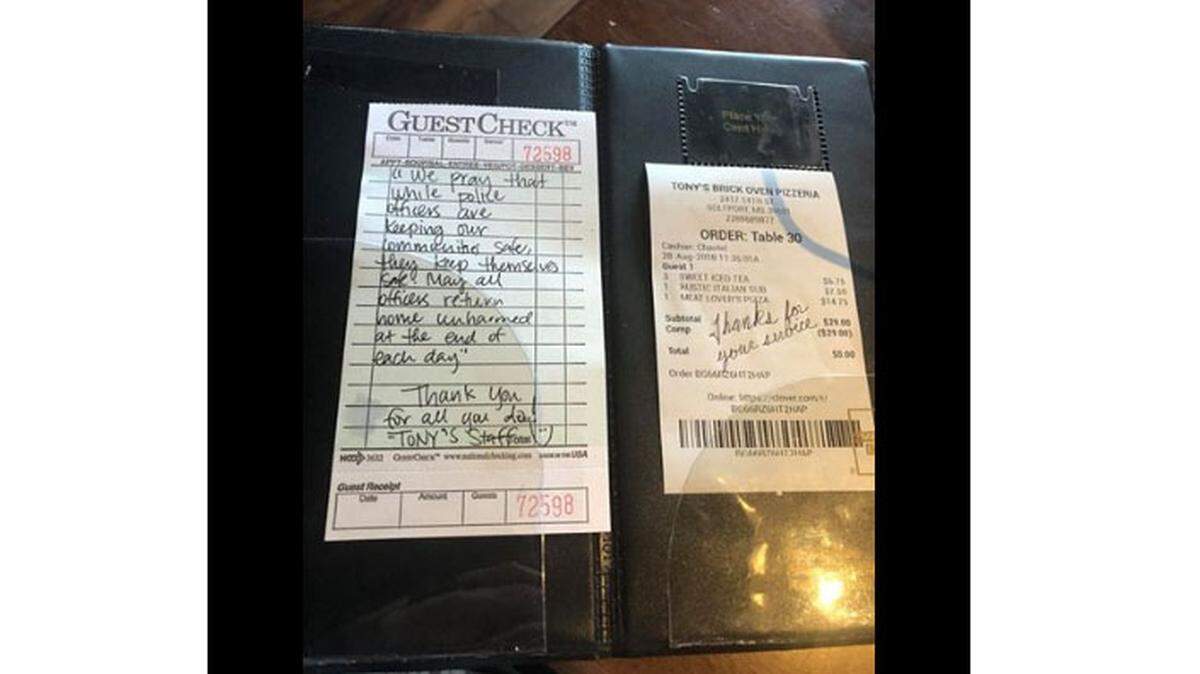 This screenshot from a Facebook post shows a kind note left by kitchen staff at a Gulfport restaurant for police officers who ate there.