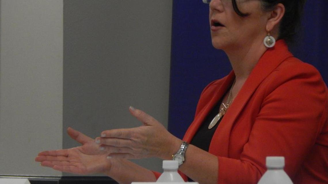 Susan Denham with the Department of Labor explains the intricacies of overtime regulations to a crowd of business leaders at a recent Mississippi Gulf Coast Chamber of Commerce event.