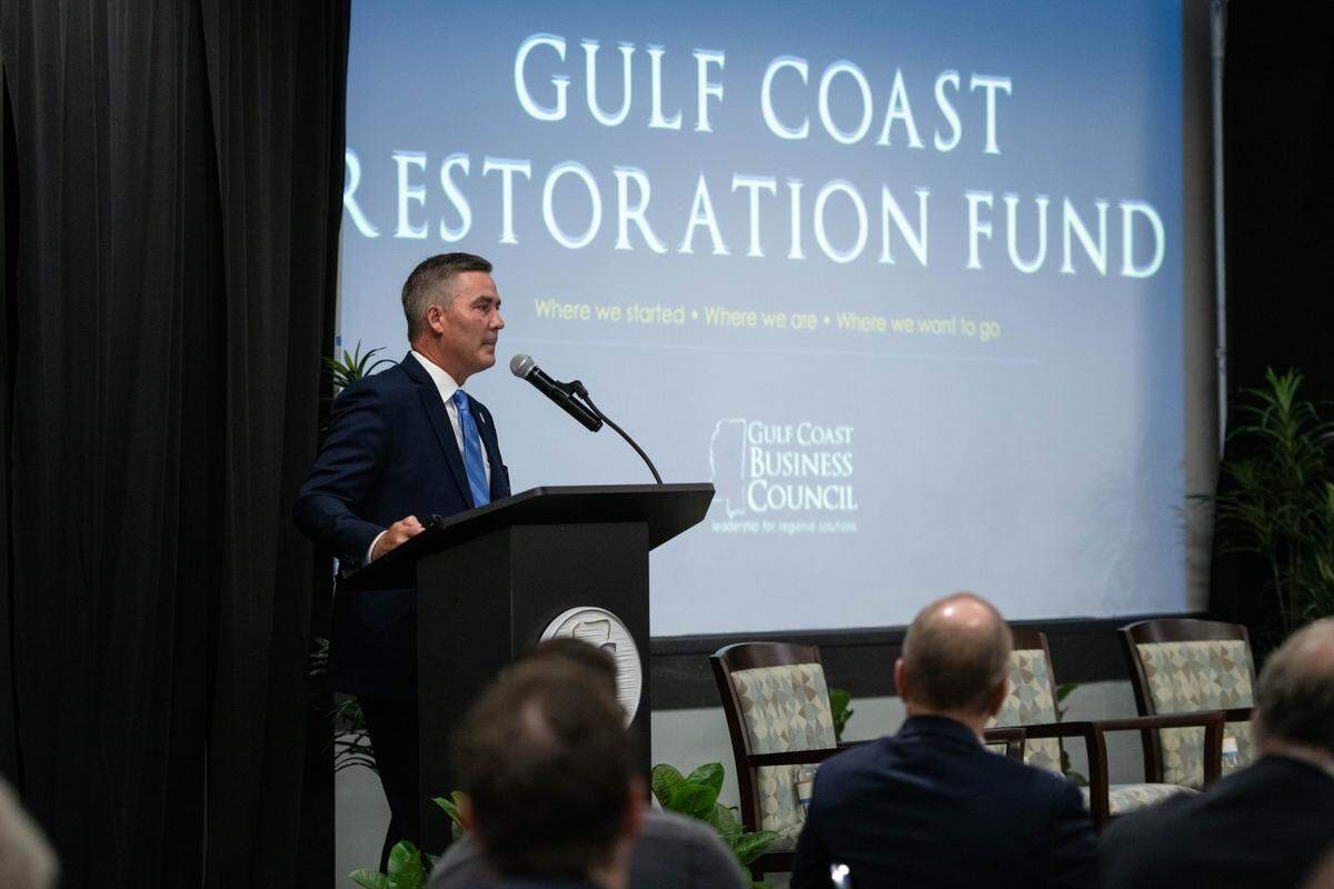 Jamie Miller, president and CEO of the Gulf Coast Business Council, updates members on the Gulf Coast Restoration Fund, which provides grants to South Mississippi projects and programs. The funds come from a legal settlement between the Gulf states and BP over the 2010 oil catastrophe.