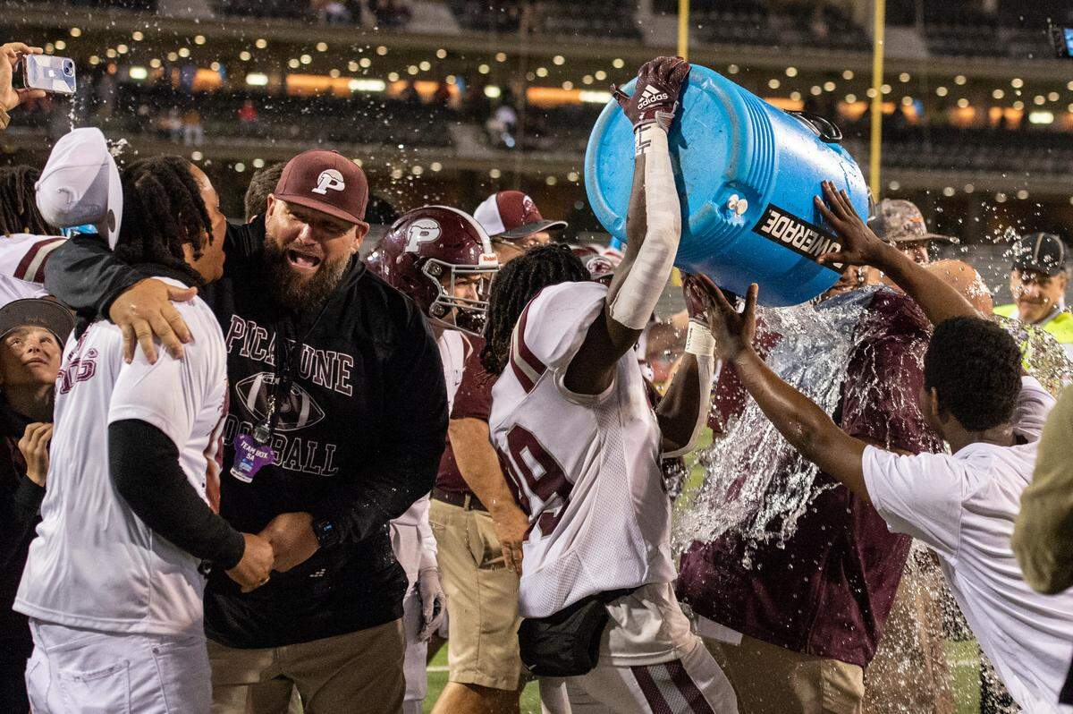 Picayune players celebrate after winning the 5A State Championship at M.M. Roberts Stadium in Hattiesburg on Friday, Dec. 2, 2022.