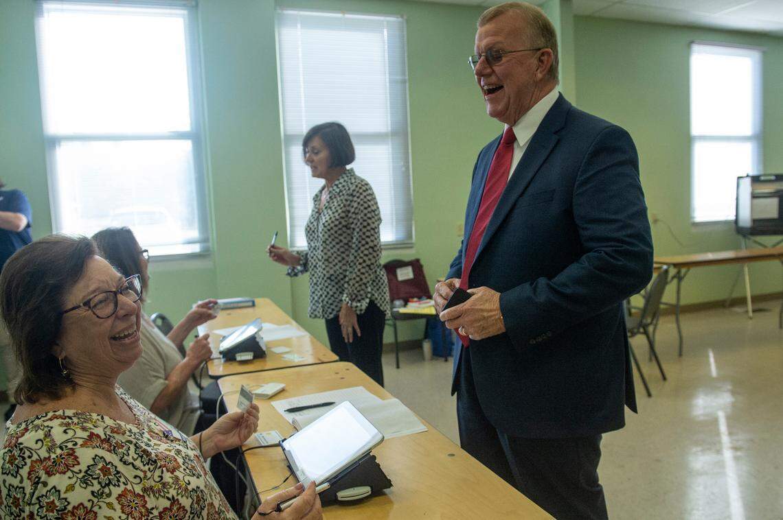 Jackson County Sheriff Mike Ezell, the Republican candidate for Mississippi’s 4th Congressional District, and his wife Suzette check in to vote at First Presbyterian Church in Pascagoula on Tuesday, Nov. 8, 2022.